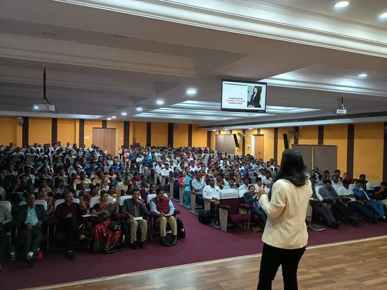 Addressing a full auditorium